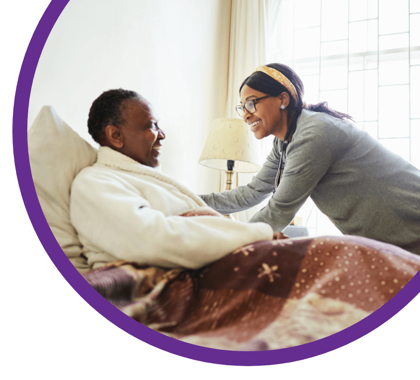 Nurse Assiting Old Woman In Bed Image Right