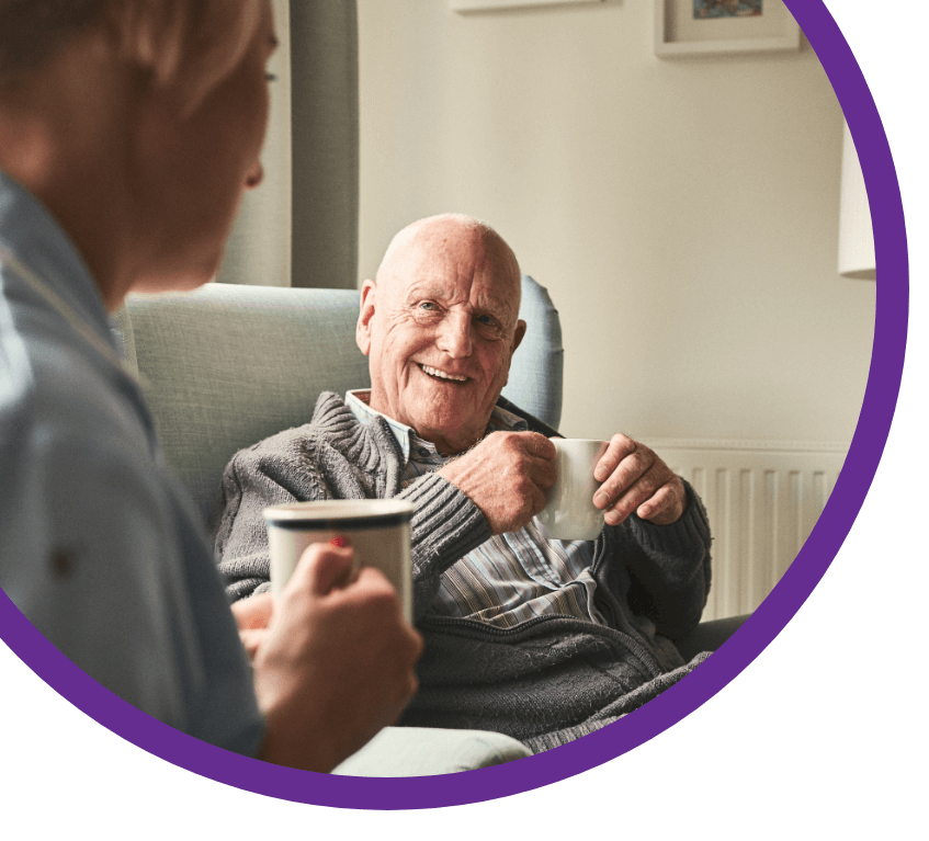 Two People Laughing With A Cup Of Coffee Image Left